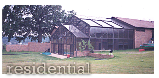 Multi-Level Glass Pool Enclosure with Brick
